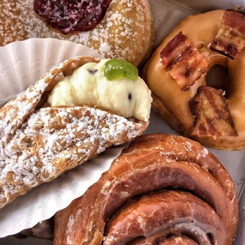 Sanremo Bakery - Box of their doughnuts and other Italian ones ... cannoli, cinnamon bun, berry doughnut, maple bacon, and apple fritter - Bakeries Near Me - Etobicoke, Ontario