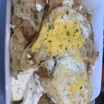 Eggstasy - Chicken chilaquiles. Tomato, green salsa, red onion, cheese and eggs - Breakfast & Brunch Near Me - Scottsdale, Arizona Eggstasy - Chicken chilaquiles. Tomato, green salsa, red onion, cheese and eggs - Breakfast & Brunch Near Me - Scottsdale, Arizona