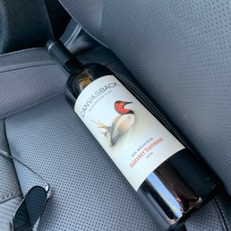 a bottle of wine in the back seat of a car a bottle of wine in the back seat of a car