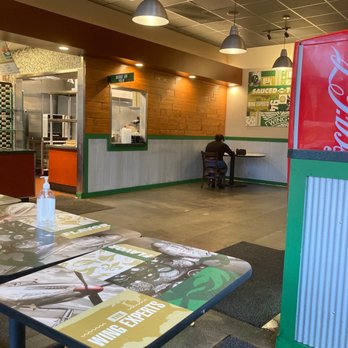 Wingstop - the inside of a fast food restaurant - Chicken Wings Near Me - Oceanside, California Wingstop - the inside of a fast food restaurant - Chicken Wings Near Me - Oceanside, California