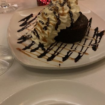 John Howie Steak Restaurant - The flourless cake that I tried. Ate mainly the whipped cream haha - Steakhouses Near Me - Bellevue, Washington John Howie Steak Restaurant - The flourless cake that I tried. Ate mainly the whipped cream haha - Steakhouses Near Me - Bellevue, Washington