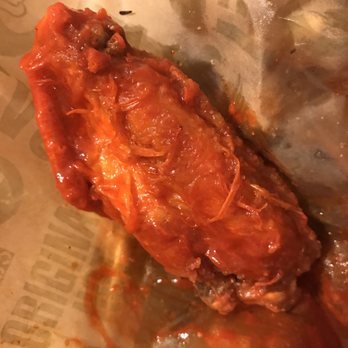 Wingstop - Fresh chicken feathers stuck on the fried hot wings - Chicken Wings Near Me - Manteca, California