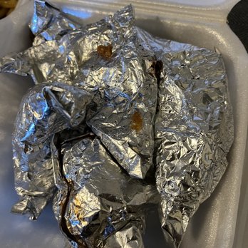 China Village - a tray of food wrapped in aluminum foil - Cantonese Near Me - Stockton, California China Village - a tray of food wrapped in aluminum foil - Cantonese Near Me - Stockton, California