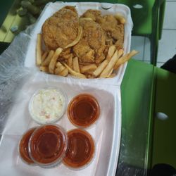 Sharks Fish & Chicken - Catfish steak, fries, cole slaw with hot sauce and ketchup.