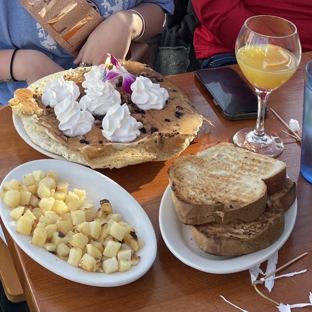 Birthday Blueberry Pancake, toast, home fries, and a mimosa