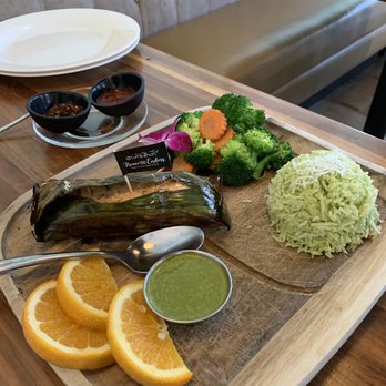 Lapisara Eatery - Lapisara's Classic salmon wrap in banana leaves on fragrant Coconut Rice - Breakfast & Brunch Near Me - San Francisco, California Lapisara Eatery - Lapisara's Classic salmon wrap in banana leaves on fragrant Coconut Rice - Breakfast & Brunch Near Me - San Francisco, California