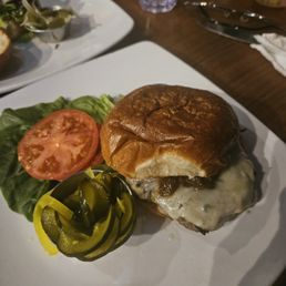 Classic cheeseburger with tasty tomato, crisp lettuce, and excellent housemade pickles.