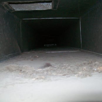 Fresh N Clean Duct Cleaning - Before photo of the dirty main trunk - Air Duct Cleaning Near Me