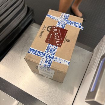 Delta Air Lines - The amazing wrap job Junessa did after hunting down a box for me! - Airlines Near Me - Denver, Colorado
