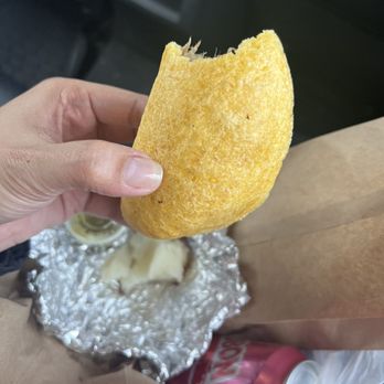 Delicias Caleñas Astoria - a hand holding a piece of food - Empanadas Near Me - Astoria, New York Delicias Caleñas Astoria - a hand holding a piece of food - Empanadas Near Me - Astoria, New York