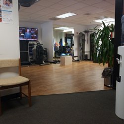 Holomua Physical Therapy - Sitting in waiting room looking into workout area.