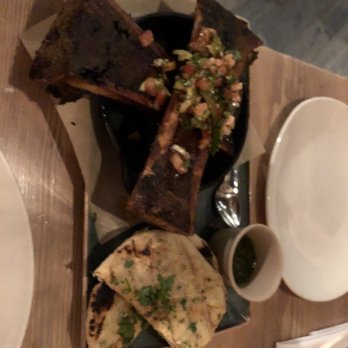 Lechon - Smoked bone marrow. Sorry for the blurry pic. I didn't want to use flash and disrupt other diners from the low key lighting ambiance. - Tapas Bars Near Me - Portland, Oregon Lechon - Smoked bone marrow. Sorry for the blurry pic. I didn't want to use flash and disrupt other diners from the low key lighting ambiance. - Tapas Bars Near Me - Portland, Oregon