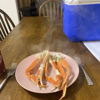 Millender & Son Seafood - crab legs on a pink plate - Seafood Markets Near Me - Carrabelle, Florida