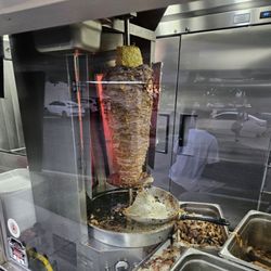Tacos El Güero - Meat on a stick with pineapple on top