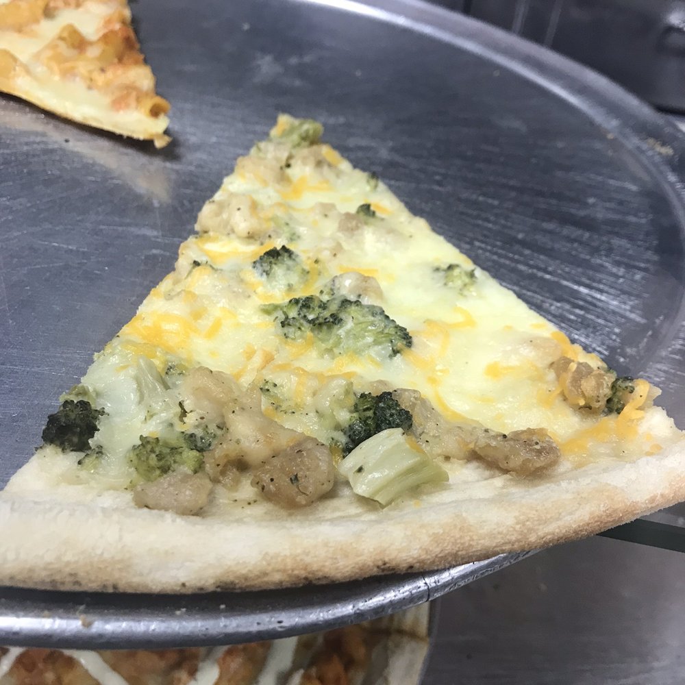 Brooklyn's Pizza - a slice of pizza on a pizza pan - Italian Near Me - Irvington, New Jersey