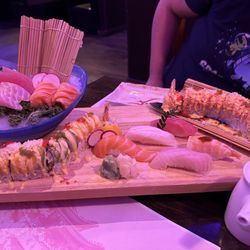 Fuji Sushi & Hibachi Grill - Tropical Roll, Angel Roll, Chefs Choice Sushi Sampler Special and Chefs Choice Sashimi Sampler Special.