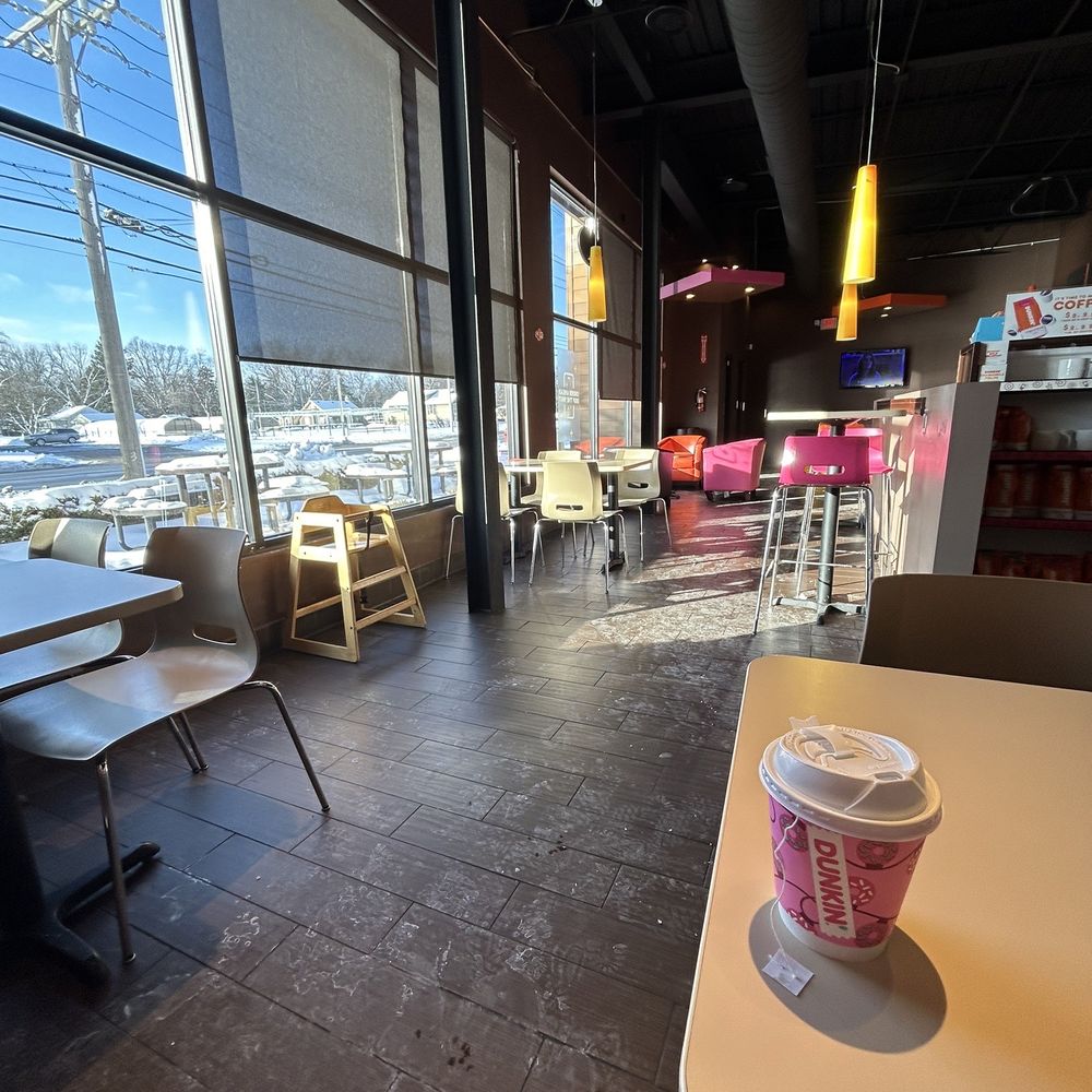 Dunkin' - a coffee cup on a table in front of a window - Donuts Near Me - Farmington, Michigan Dunkin' - a coffee cup on a table in front of a window - Donuts Near Me - Farmington, Michigan