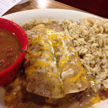 Fuzzy's Taco Shop - Enchilada plate with cilantro lime rice and Borracho beans. - Tex-Mex Near Me - Orlando, Florida Fuzzy's Taco Shop - Enchilada plate with cilantro lime rice and Borracho beans. - Tex-Mex Near Me - Orlando, Florida