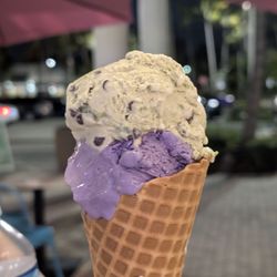 Lily’s Handmade Ice cream - Ube ice cream scoop with Mint Chocolate chip in a waffle cone.