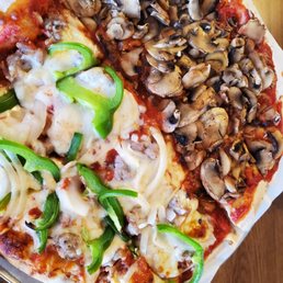Half no cheese, extra mushrooms, half with cheese and the works.