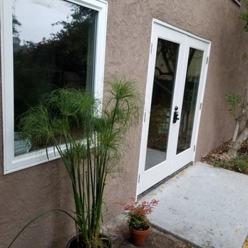McNichols Construction - French doors and window with slab, all new.  Exterior shot. - General Contractors Near Me