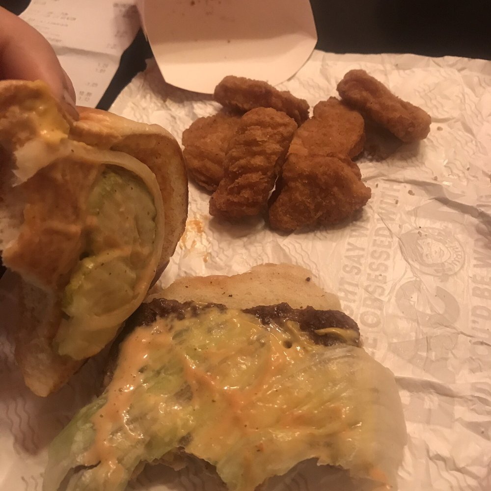 Wendy's - a person eating a sandwich and fried chicken - Fast Food Near Me - New Castle, Pennsylvania Wendy's - a person eating a sandwich and fried chicken - Fast Food Near Me - New Castle, Pennsylvania