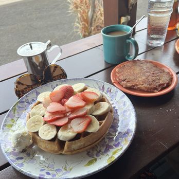 Kountry Kitchen - Belgian Waffle with fresh strawberries and bananas with a side of corned beef hash! And a cup of their own special brewed drip coffee - American Near Me - Kapaa, Hawaii Kountry Kitchen - Belgian Waffle with fresh strawberries and bananas with a side of corned beef hash! And a cup of their own special brewed drip coffee - American Near Me - Kapaa, Hawaii