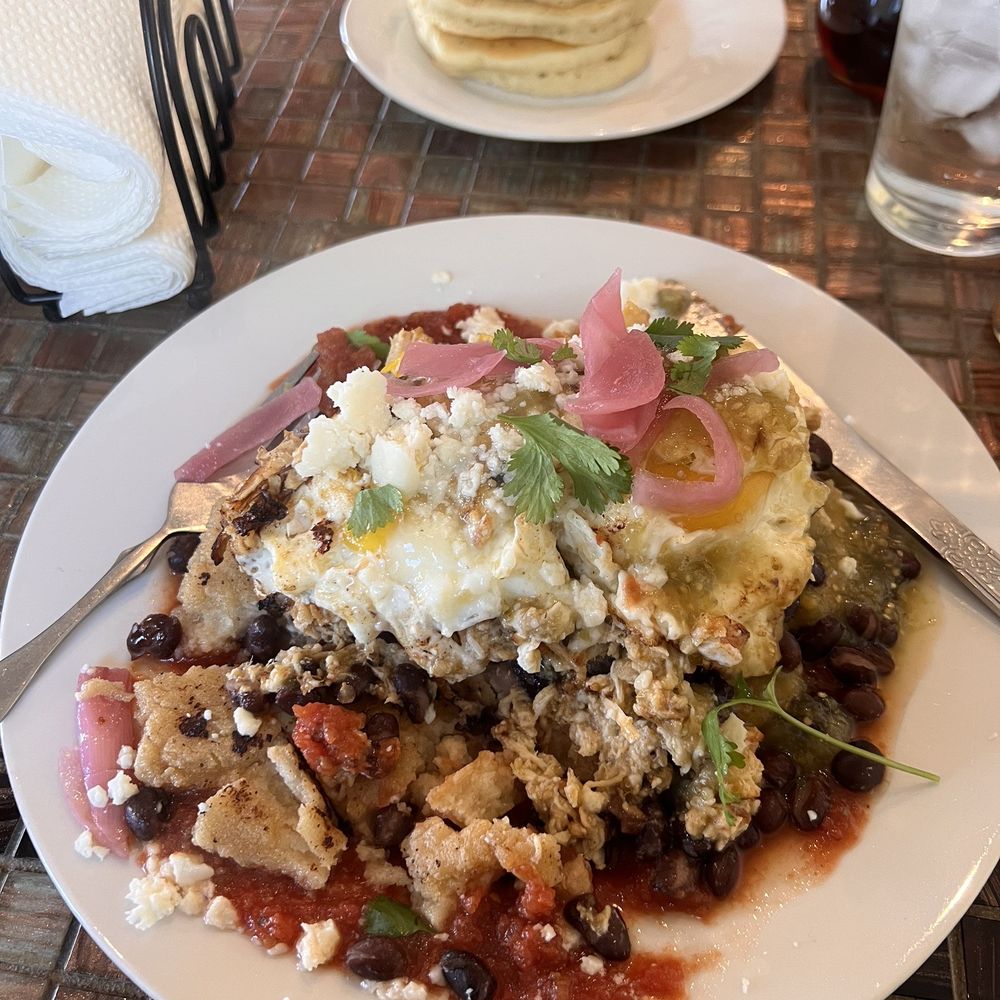 Minton's 760 - Huecos rancheros with chicken Short stack in the back - New American Near Me - Kentucky, Kentucky Minton's 760 - Huecos rancheros with chicken Short stack in the back - New American Near Me - Kentucky, Kentucky