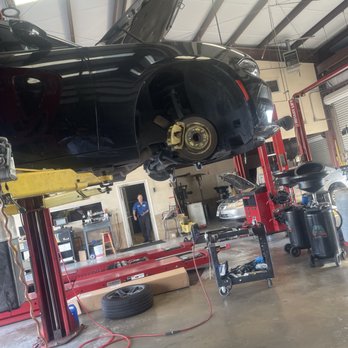 Logan's Auto - Billy in the back running to action - Auto Repair Near Me - Houston, Texas Logan's Auto - Billy in the back running to action - Auto Repair Near Me - Houston, Texas