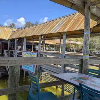 Gator Joe's - a man sitting at a table outside - Seafood Near Me - Ocklawaha, Florida Gator Joe's - a man sitting at a table outside - Seafood Near Me - Ocklawaha, Florida