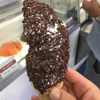 Dari Land - a hand holding an ice cream cone with chocolate sprinkles - Bakeries Near Me - Riverhead, New York