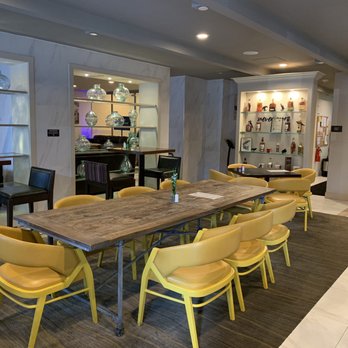 Tell Tale Restaurant - a long table with yellow chairs - American Near Me - Baltimore, Maryland Tell Tale Restaurant - a long table with yellow chairs - American Near Me - Baltimore, Maryland