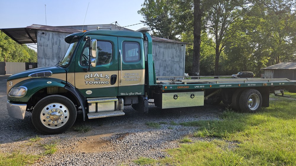 RIALS TOWING INC