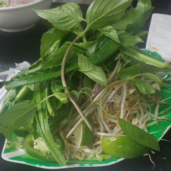 Pho 79 - Plate full of sprouts, basil, culantro, jalapenos and limes that you can add to your pho - Vietnamese Near Me - Davie, Florida Pho 79 - Plate full of sprouts, basil, culantro, jalapenos and limes that you can add to your pho - Vietnamese Near Me - Davie, Florida