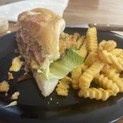 The Porch - The best burger I've ever tasted!  It has everything!!  The porch burger is full of tasty meat.. chicken, ham, beef and veggies