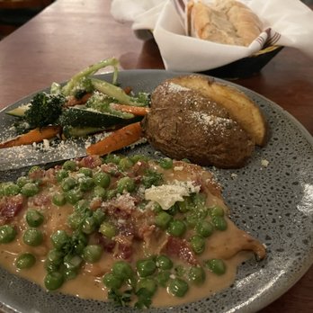 Il Capriccio - Chicken special of the night. Chicken breast in a cream sauce with peas and prosciutto served with roasted potatoes and vegetables. - Italian Near Me - Los Angeles, California