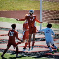 Becker’s Endurance & Athletic Training - High school soccer client winning a header to secure the win.
