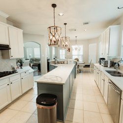 Kitchen remodel in Spring TX! Painted cabinets, quartz countertops, and new lighting fixtures!
