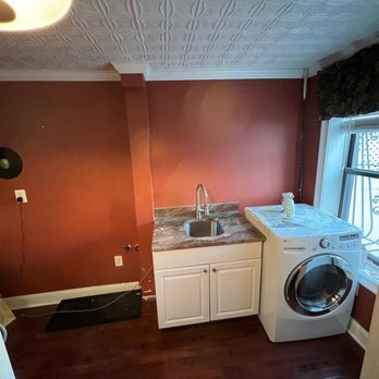 DLS Construction - a kitchen with a washer and dryer - General Contractors Near Me DLS Construction - a kitchen with a washer and dryer - General Contractors Near Me