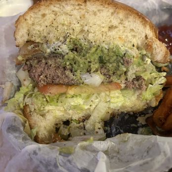 Texas Tradition - Guacamole burger cut in half - American Near Me - Katy, Texas Texas Tradition - Guacamole burger cut in half - American Near Me - Katy, Texas