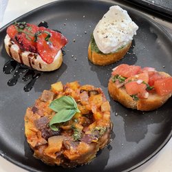 Italy From Scratch - Yes, we made all these, too. A strawberry goat cheese crostini, a pesto and burrata crostini, a yummy bruschetta, and delish copanatta.