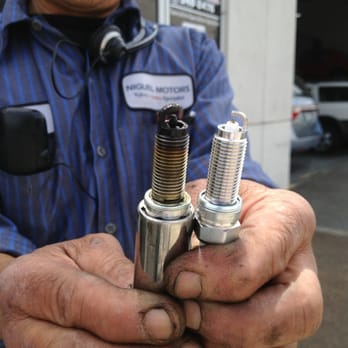 Niguel Motors - Left - burnt spark plug; right - new spark plug - Auto Repair Near Me - Laguna Hills, California Niguel Motors - Left - burnt spark plug; right - new spark plug - Auto Repair Near Me - Laguna Hills, California