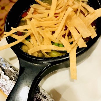 Chuy's - Tortilla Soup Homemade chicken broth, roasted chicken, avocado, corn, green chiles, tomatoes & cilantro, topped w cheese+tortilla strips. - Tex-Mex Near Me - Jacksonville, Florida Chuy's - Tortilla Soup Homemade chicken broth, roasted chicken, avocado, corn, green chiles, tomatoes & cilantro, topped w cheese+tortilla strips. - Tex-Mex Near Me - Jacksonville, Florida
