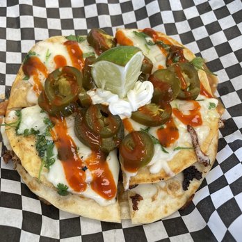 Fuego Taco - a close up of a flatbread pizza - Tacos Near Me - Midwest City, Oklahoma