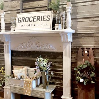 The Local -  a fireplace with a sign on it - Wine Tasting Room Near Me - Mount Vernon, Iowa