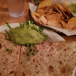 Quesadilla and Chips&Guac in the back Quesadilla and Chips&Guac in the back