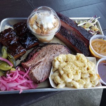 Interstellar BBQ - From top left - Peach infused Pork Belly, Banana Pudding, Pork Ribs, Brisket, Mac and Gouda cheese, - Barbeque Near Me - Austin, Texas