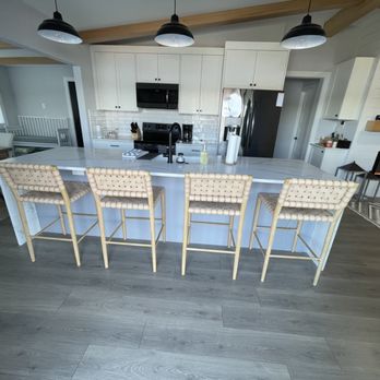 TL Remodeling - a kitchen with white cabinets and bar stools - General Contractors Near Me - Kirkland, Washington TL Remodeling - a kitchen with white cabinets and bar stools - General Contractors Near Me - Kirkland, Washington