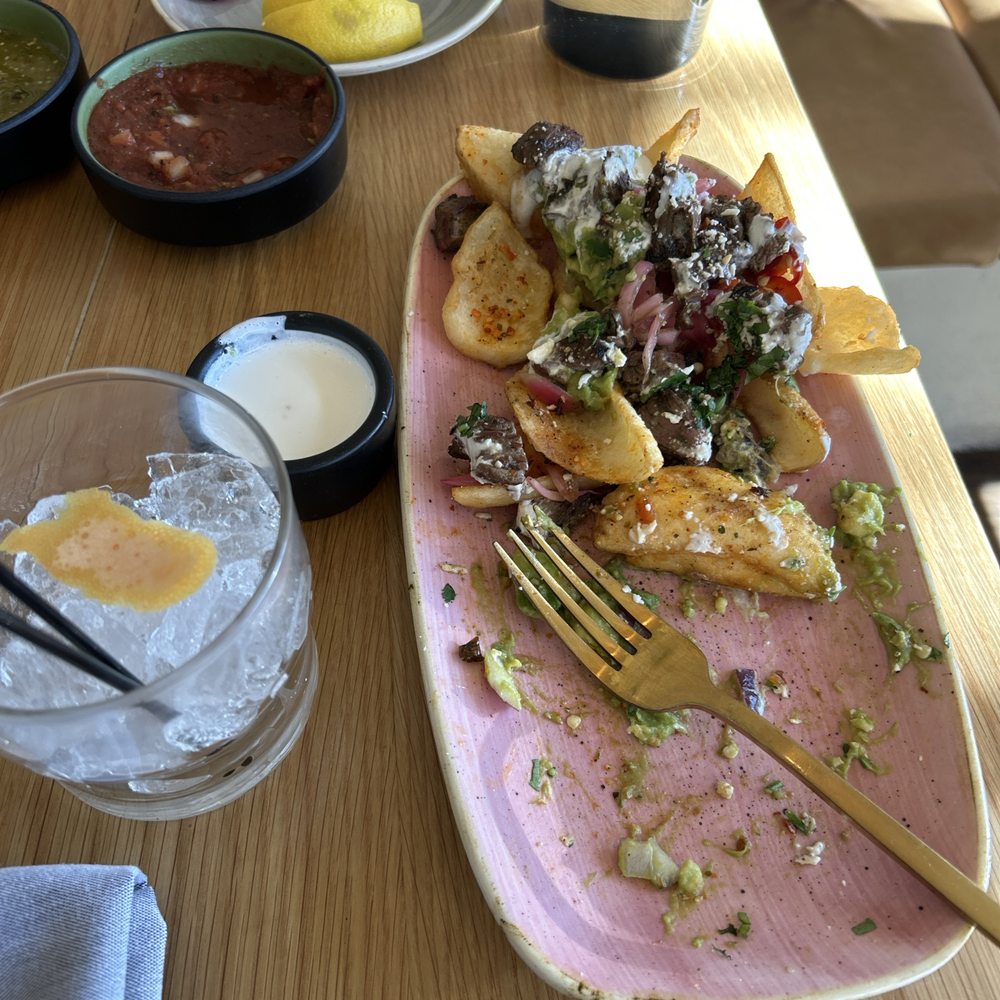 Lady Nomada - Mexican Kitchen - Carne Asada Fries Paloma mocktail - Mexican Near Me - Arvada, Colorado Lady Nomada - Mexican Kitchen - Carne Asada Fries Paloma mocktail - Mexican Near Me - Arvada, Colorado