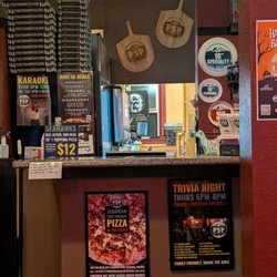 Puget Sound Pizza - Downtown Tacoma - Front counter, lots of specials and events
